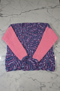 Crochet cardigan on grey marble background